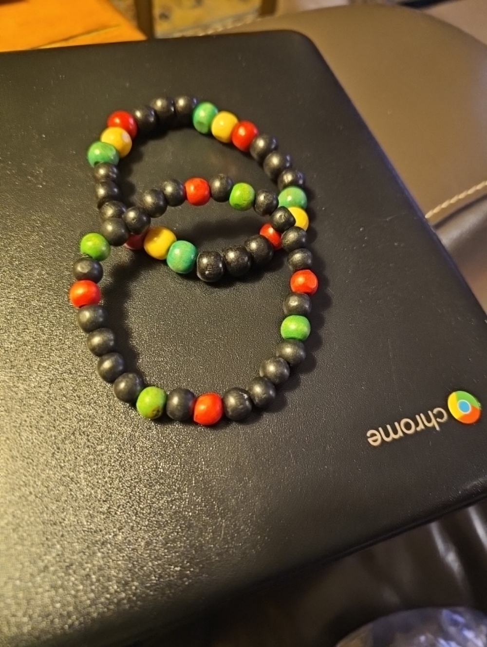 Hand Reggae style beaded That feature the iconic red, yellow, green, and black.